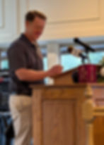 Craig Lundgren, board member, updated the crowd about the signage project.