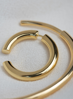 golden bracelet and earring in abstract lineplay by adorn