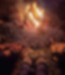 A fire burning at night with three sets of feet wearing mocasins stretched out to the warmth of the flames.
