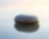 A stone sitting is still water.