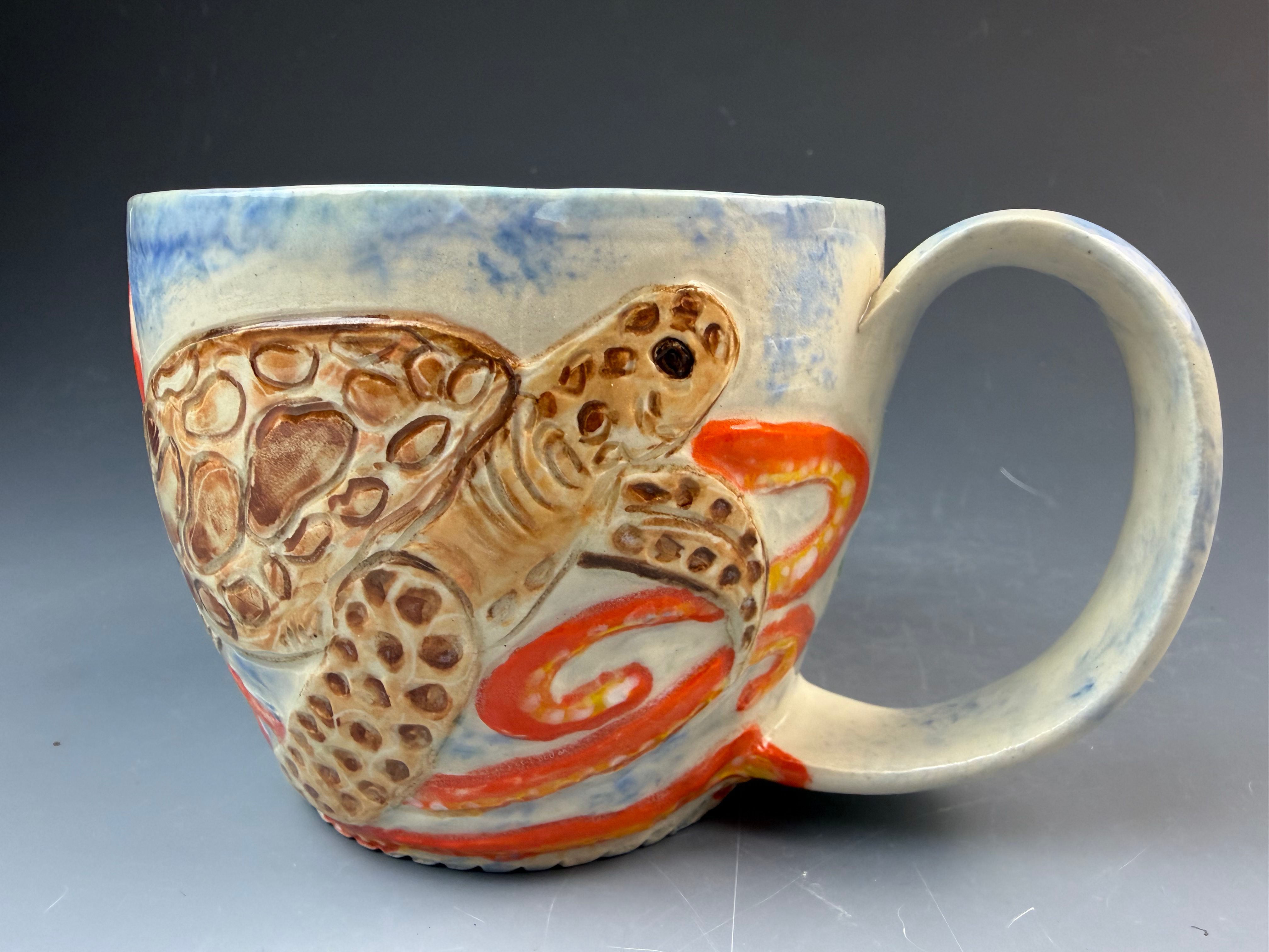 Sea turtles swimming with an octopus mug