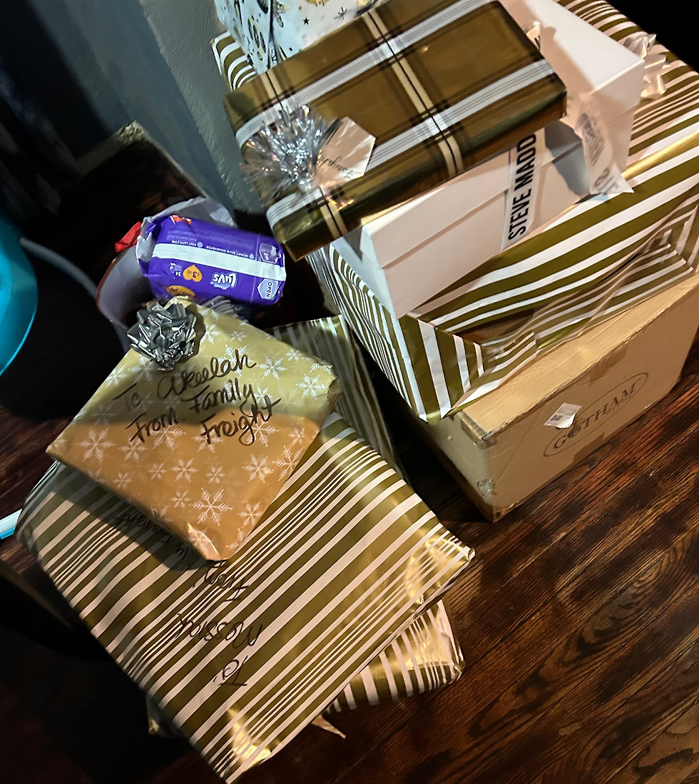 A pile of Christmas presents provided by Family Freight Academy to a local family in need