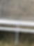 white zip tie fastened around pvc pipe through netting