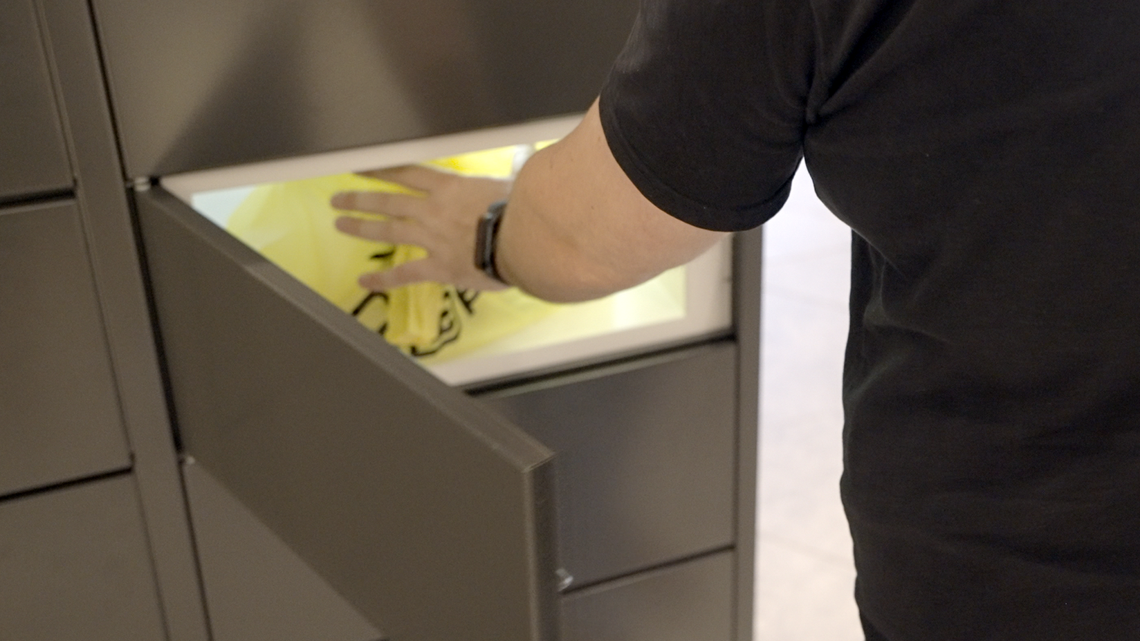 Resident collecting food from locker