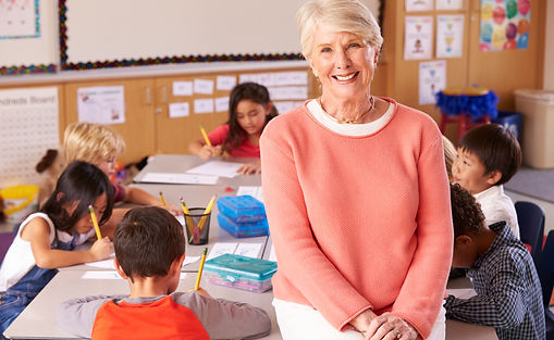 older teacher with class AdobeStock_104937354.jpeg