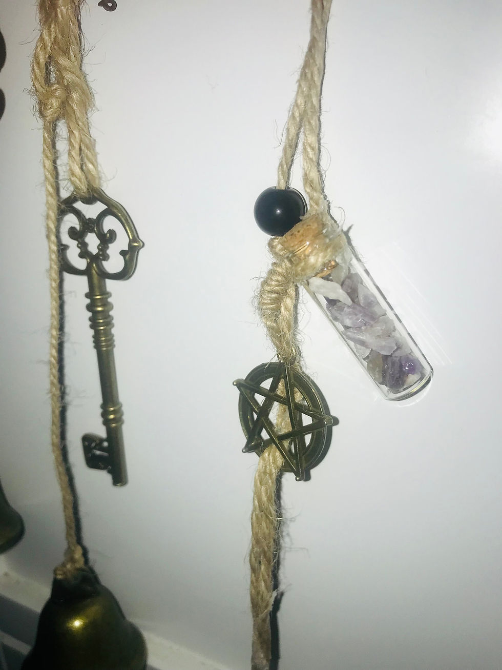 Thumbnail: Antique key and amulet hanging with a small glass bottle; Cat-Tastic Wonders.