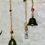Thumbnail: Beads, Bells, and amulet hanging in small glass bottle; Cat-Tastic Wonders