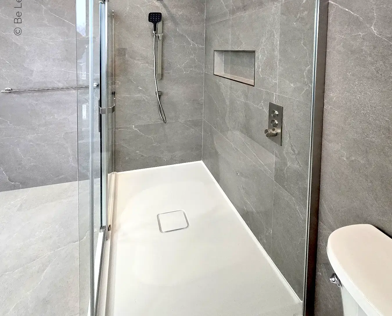 bathroom remodel glass shower door grey tile walls white tray