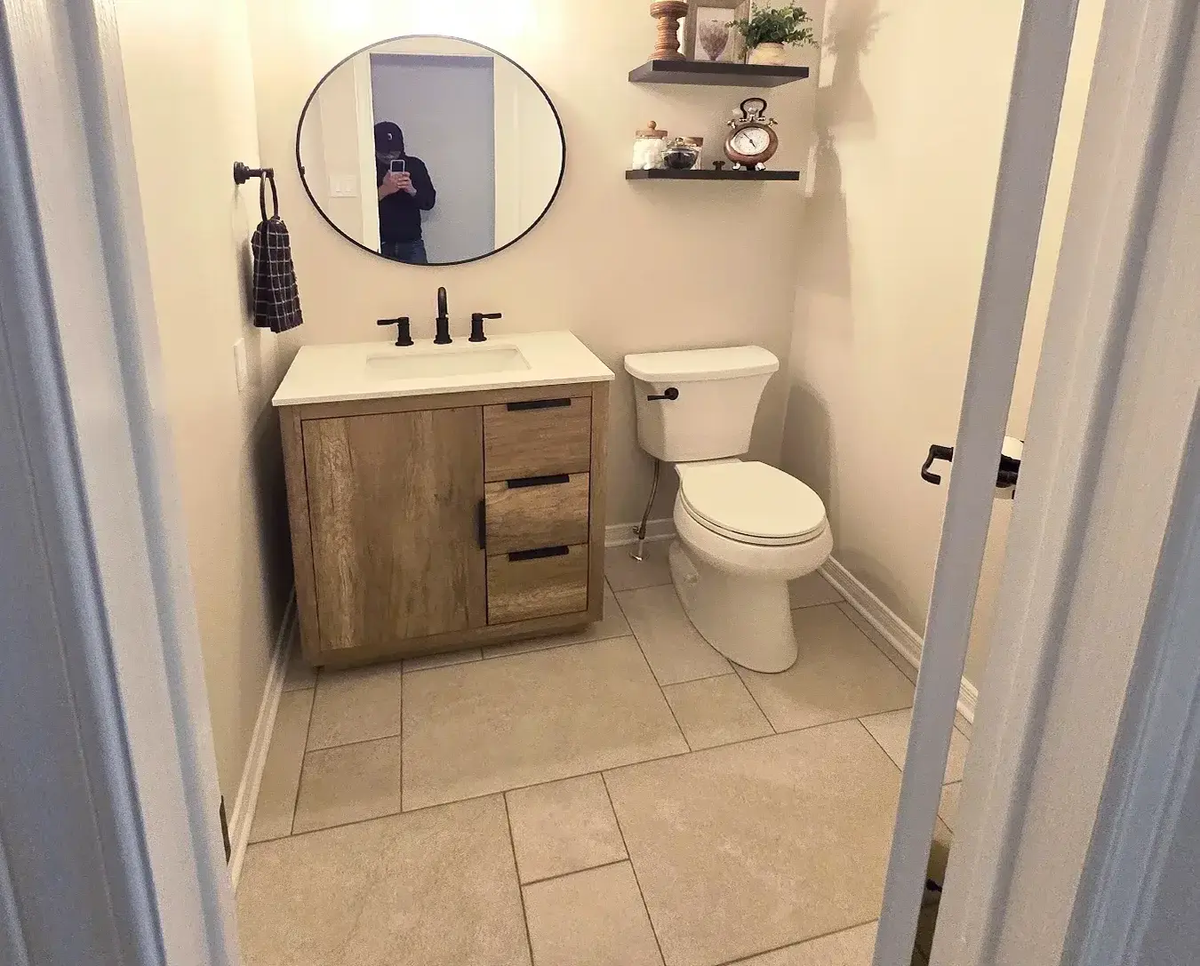 Bathroom vanity wood grain black hardware tile floor