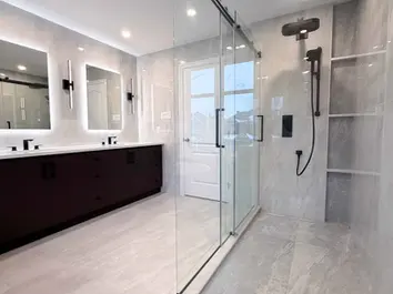 elegant bathroom with custom shower and two mirrors