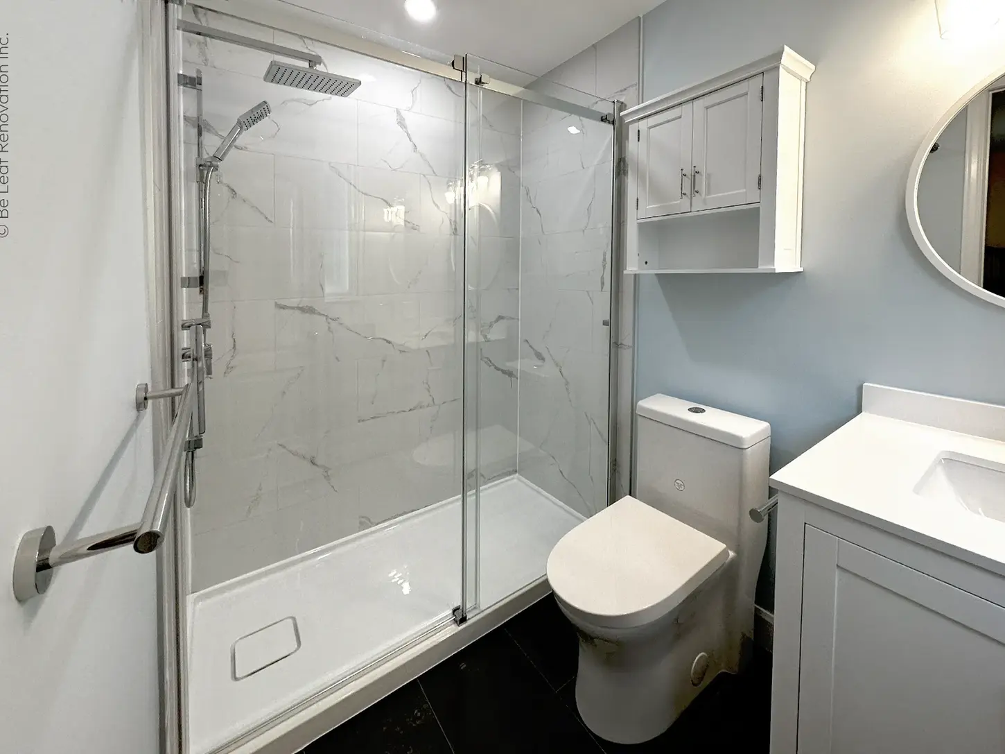 Walk-in shower remodel with glass door marble tile vanity