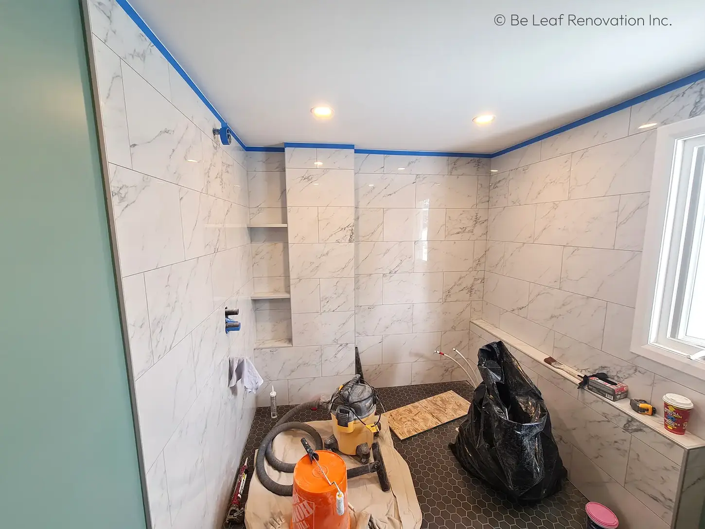 bathroom remodel marble wall tile installation grey floor tile