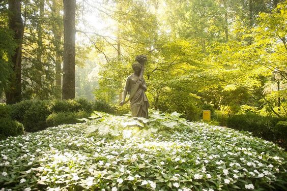 Stone statue in summer garden