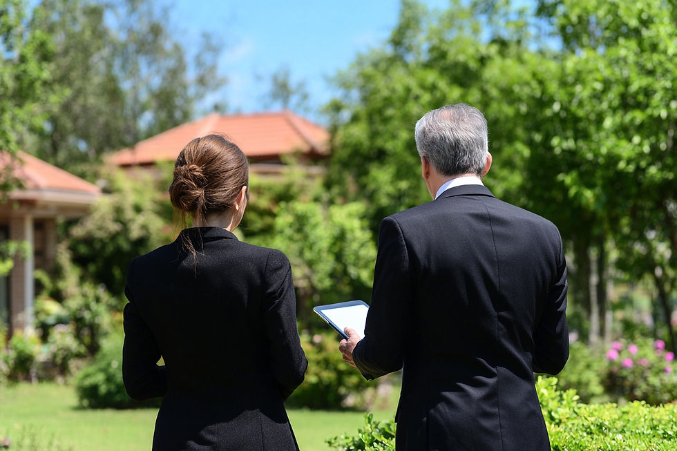 Two private household professionals overseeing the grounds of a luxury estate, representing Domestic Couple property management and care.