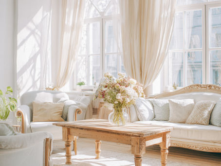 Sunlit luxury living room representing the calm organization of a well-managed household.