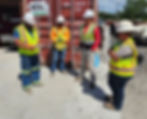 four construction workers talking