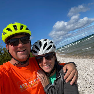 Couple bike riding in Presque Isle on the Great Loop