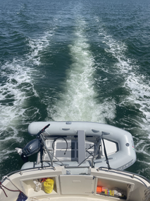 AB inflatable dinghy on back of great loop camano 31 trawler boat