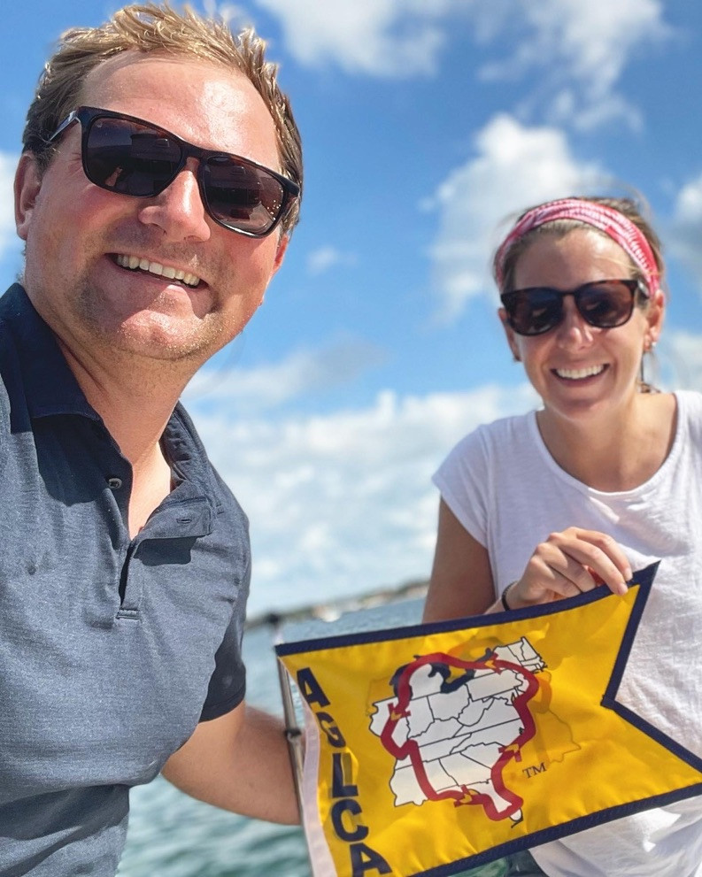 Crossing our wake with our gold Great Loop flag