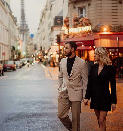 chic Paris couple photoshoot on the street with the Eiffel Tower in the background