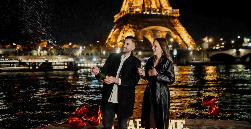 paris proposal couple pop champaign celebration at eiffel tower .jpg