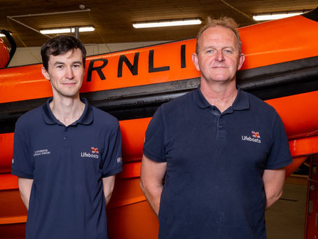 Matthew Nelson, newly qualified Helm, with Coastal Lifeboat Trainer Sean Ginnelly at Carrybridge RNLI.