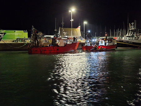 Howth RNLI ILB with fishing vessels