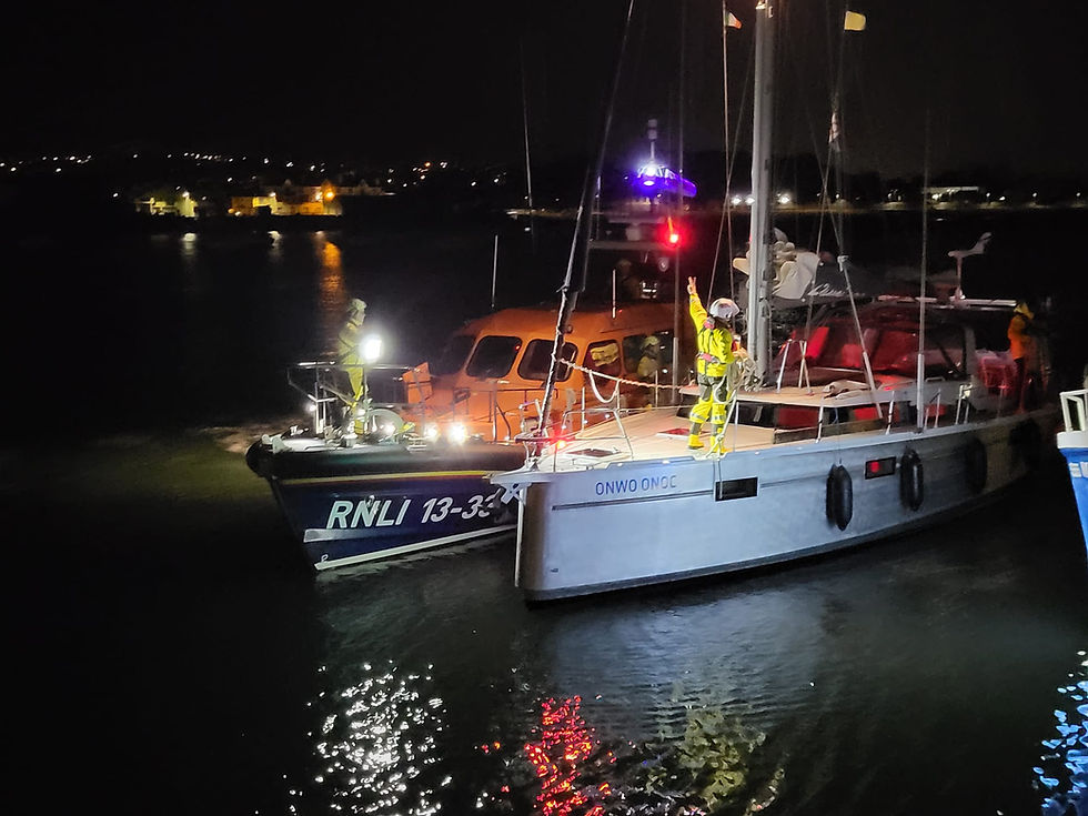 Wicklow Lifeboat with the casualty vessel back in Wicklow Harbour