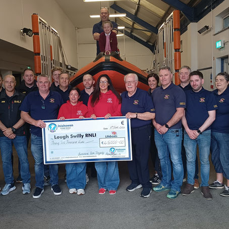 RNLI Volunteers receiving cheque for €45,000 from Louise James on behald of the Remember Me Campaign