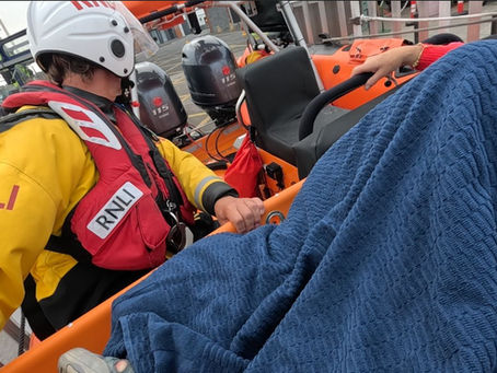 Skerries RNLI returning to the station with the casualty.