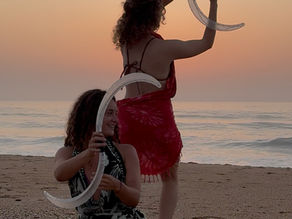 Clara Free Spirit and her friend flowing with buugeng on the beach