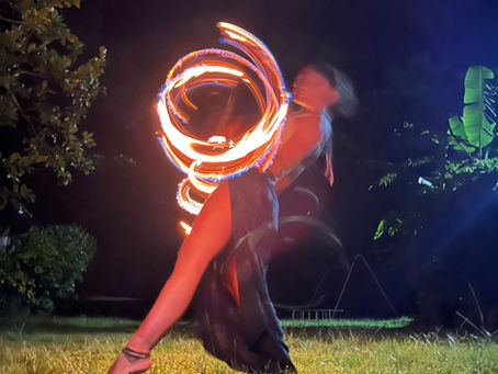 Clara Free Spirit flow and dance with her fire dragon staff