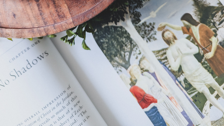An image of a book shows artwork depicting the Baptism of Jesus by St. John the Baptist.
