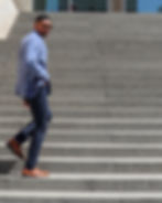 man in blazer on steps