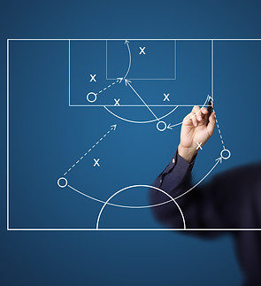 soccer coach drawing strategy plan.jpg
