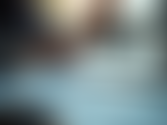 physical analytic documents on table with people around the table verses laptop suggesting the difference between traditional payment disputes and IDR technology 