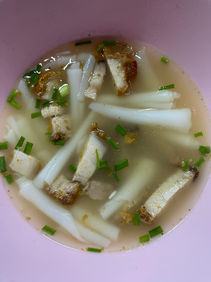 Rolled noodles soup with crispy pork belly 