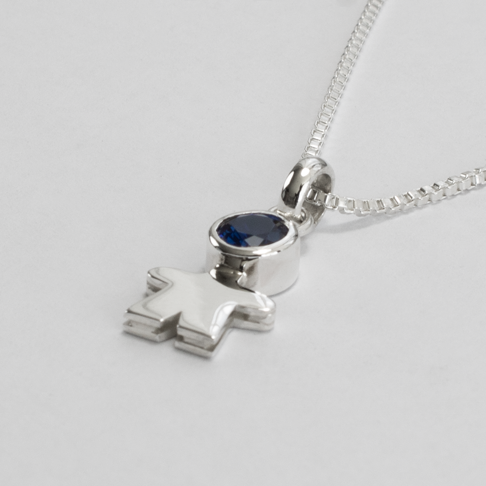 Dije niño de luz zafiro