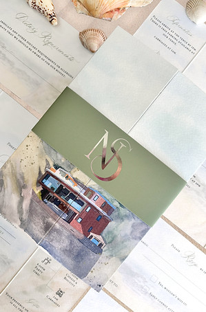 Gatefold illustrated seascape invitation with a sage green silver foiled bellyband