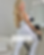 Modelo usando macacão flare branco feminino Mykonos SKYM com modelagem anatômica e tecido premium