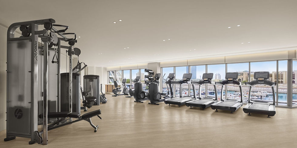 State-of-the-art fitness center at The Miami Beach EDITION, featuring a variety of equipment for personalized training sessions with Theo Marcopoulos - Personal Trainer Miami Beach.