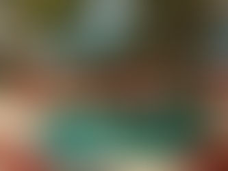 Enjoy your Miami Beach stay and fitness journey with Theo Marcopoulos at the luxurious Faena pool, surrounded by vibrant red and white sun loungers and palm trees.