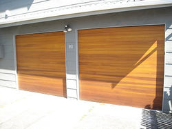 Matching_horizontal_cedar_tilt_doors_1