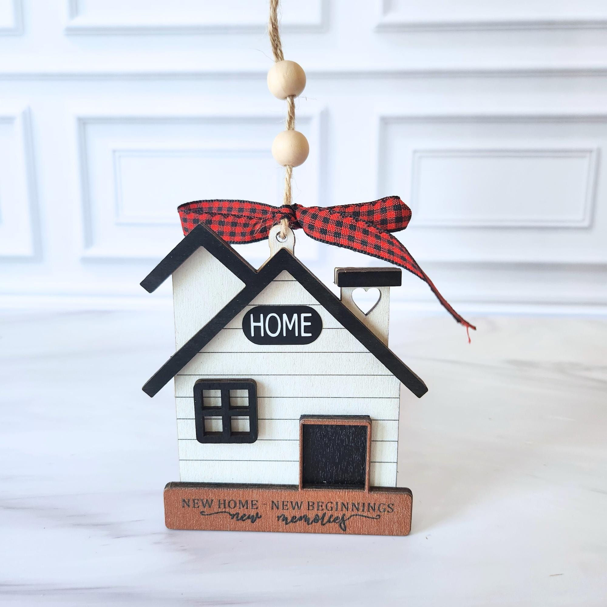 New Home wooden ornament with 'HOME' and red bow