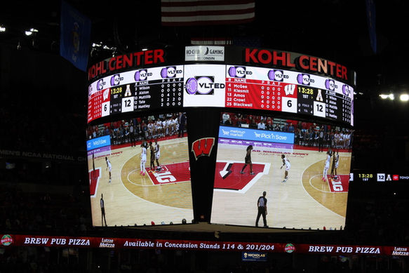 VLTED on the TV at a basketball game at the University of Wisconsin