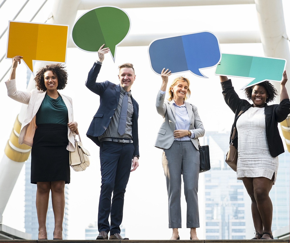 Diverse Group Holding Chat Bubbles