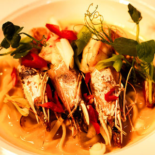 Juicy prawns served on a bed of soft noodles with fresh greens, sliced chilli, and spring onions — a vibrant Asian-inspired seafood dish at Rossett Hall Hotel.