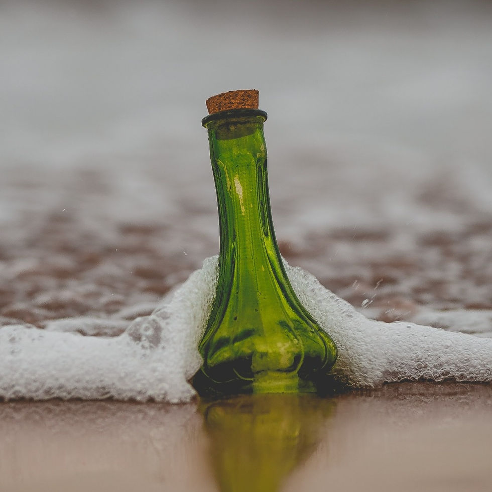 Bottle stuck with incoming tide.