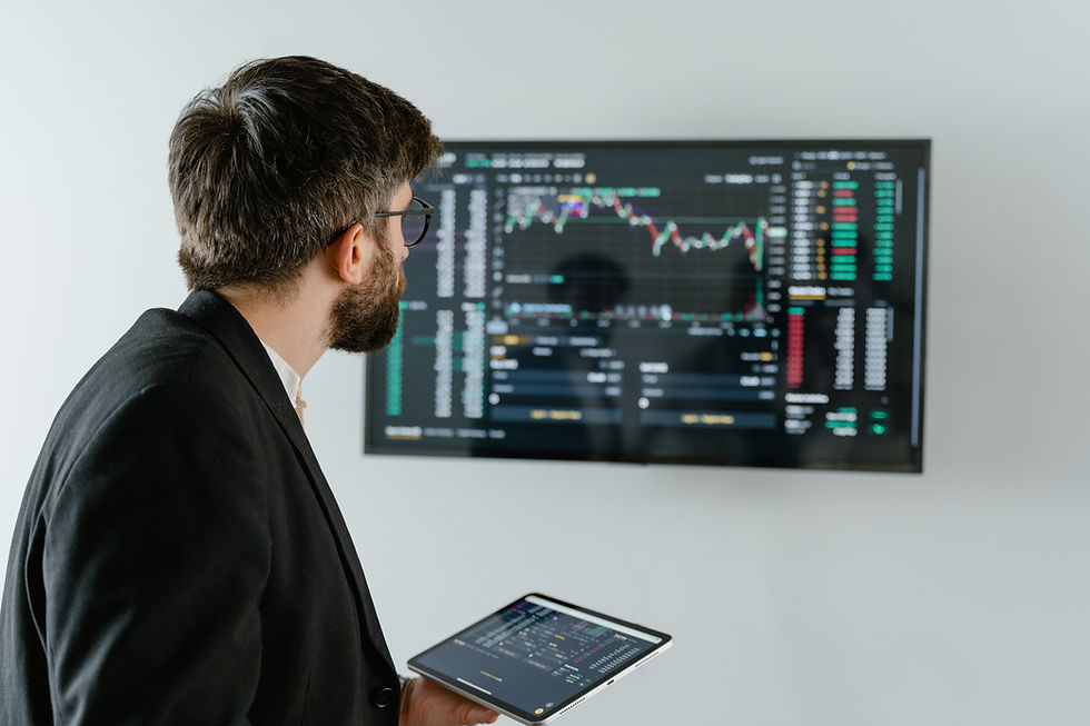 Focused trader analyzing binary options charts for profitable decisions in the financial market.