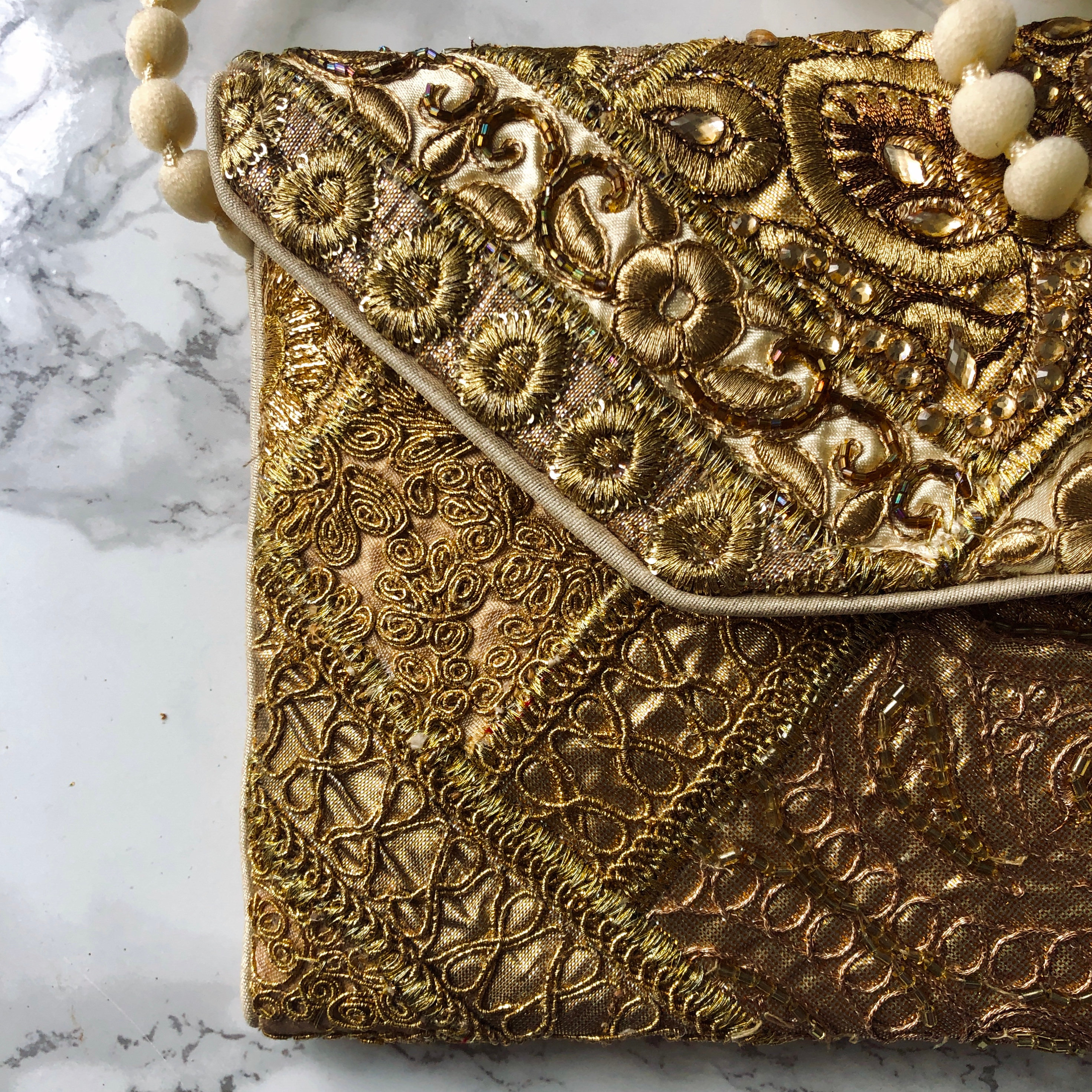gold embellished clutch bag